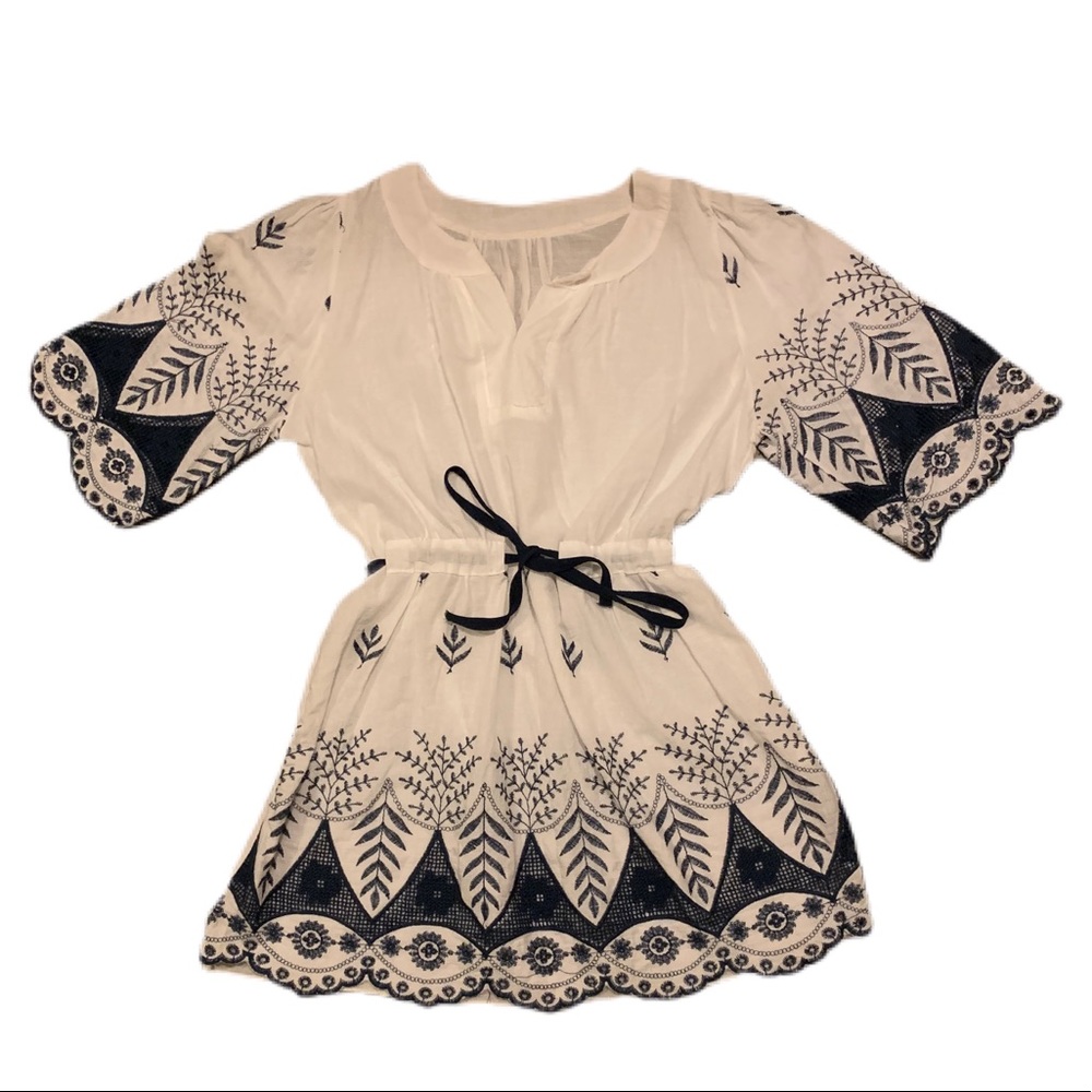 white blouse with blue embroidery